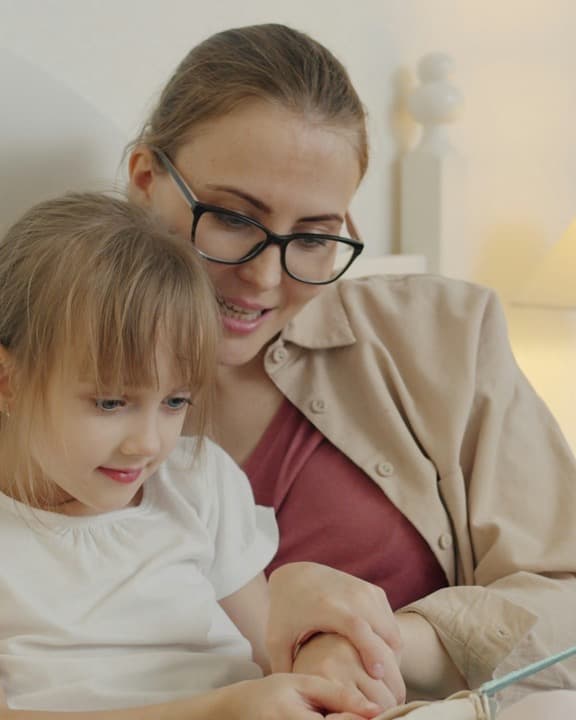 A family at home together, relaxed and at ease
