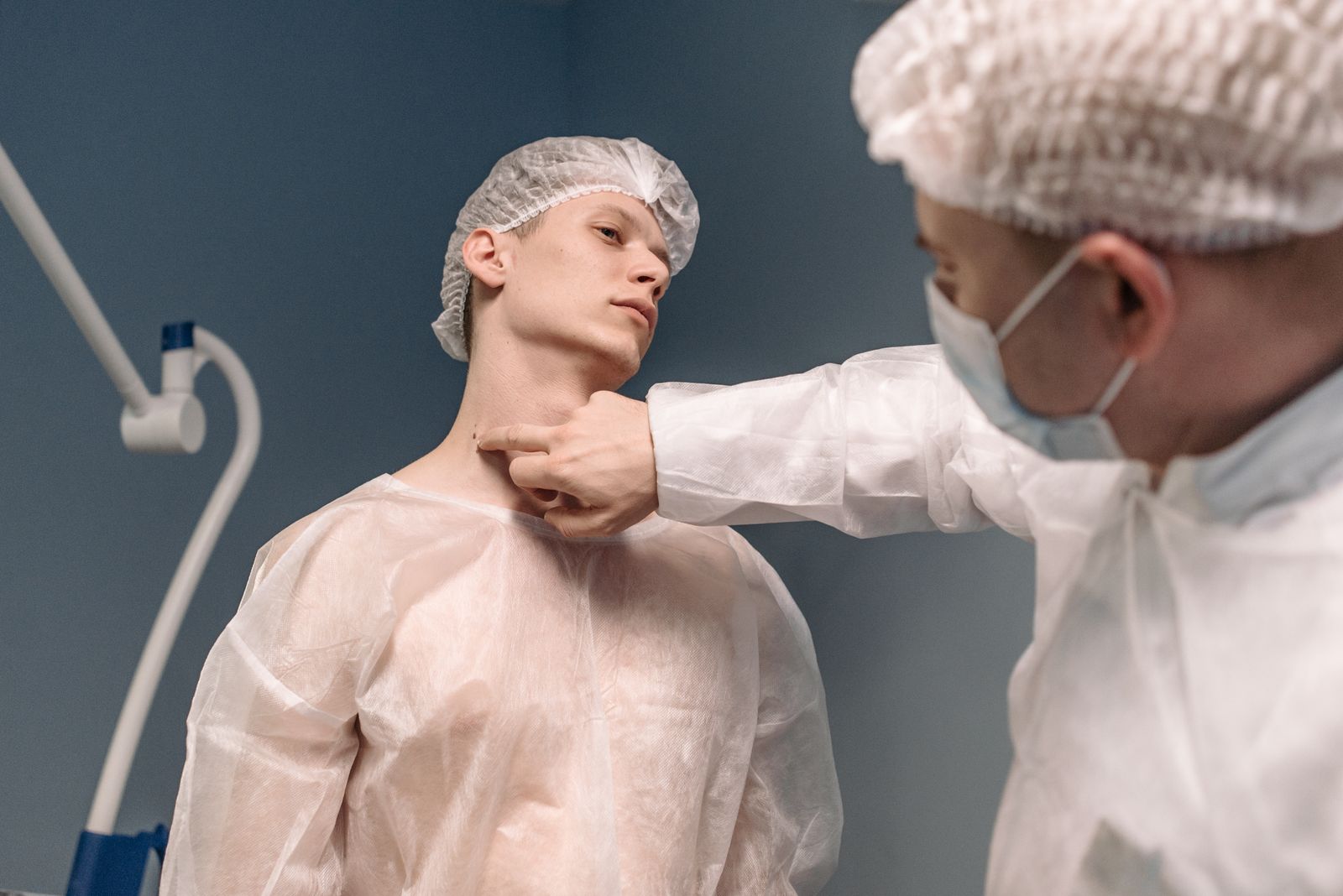 Specialist examining and assessing a patient for lumps or swelling